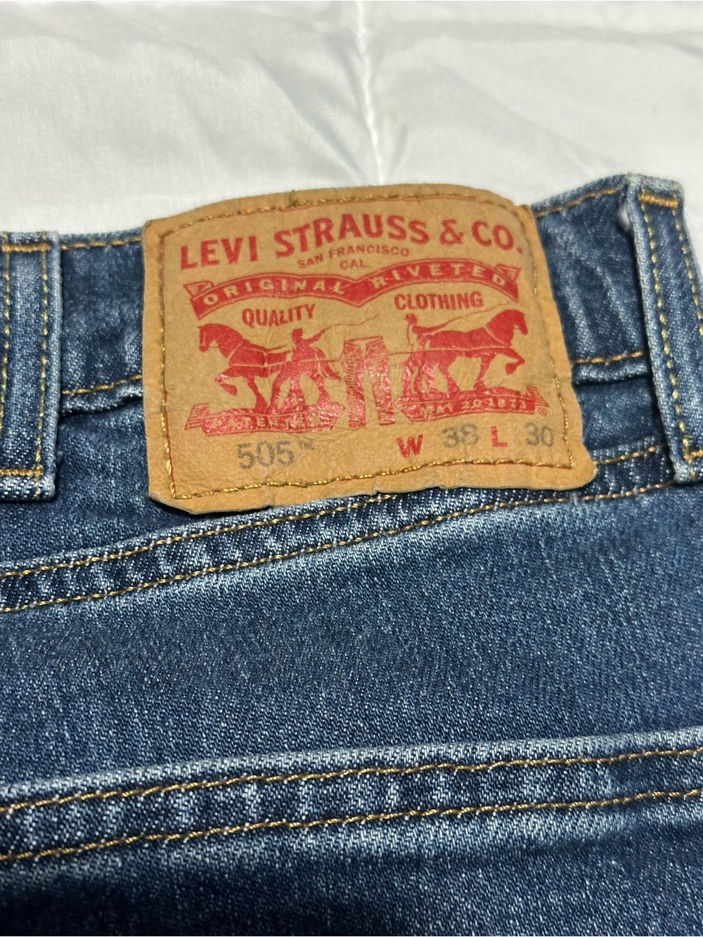 Levi's Straight Men's Jeans in Indigo Blue with Tan Patch